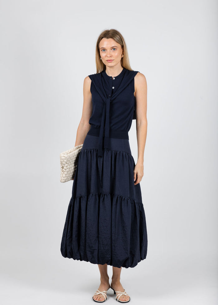 Autumn Cashmere Button Front Vest With Tie Sleeve in Navy paired with Cinq a Sept Blythe Skirt in Navy available at Barbara Katz
