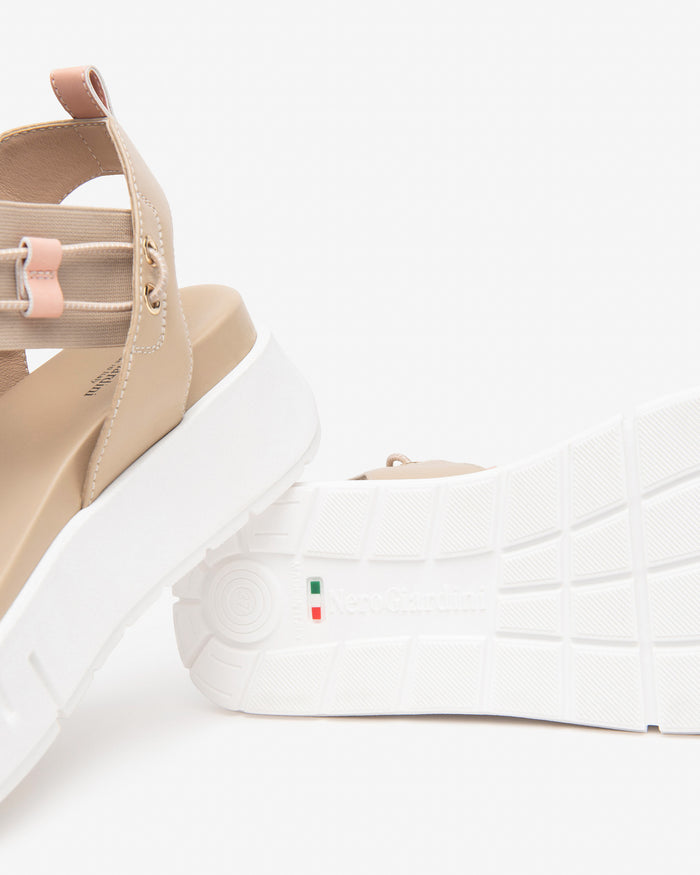 Nero Giardini Bungee Platform Flat Sandal in Beige available atBarbara Katz
