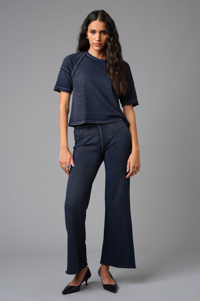 Goldie Denim Wash Raglan Top in Navy paired with Goldie Denim Wash Crop Flare Sweatpants in Navy available at Barbara Katz