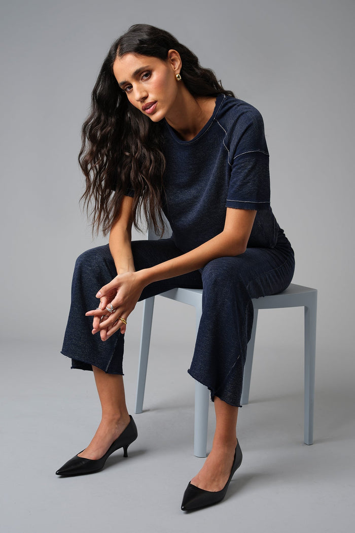 Goldie Denim Wash Raglan Top in Navy paired with Goldie Denim Wash Crop Flare Sweatpants in Navy available at Barbara Katz
