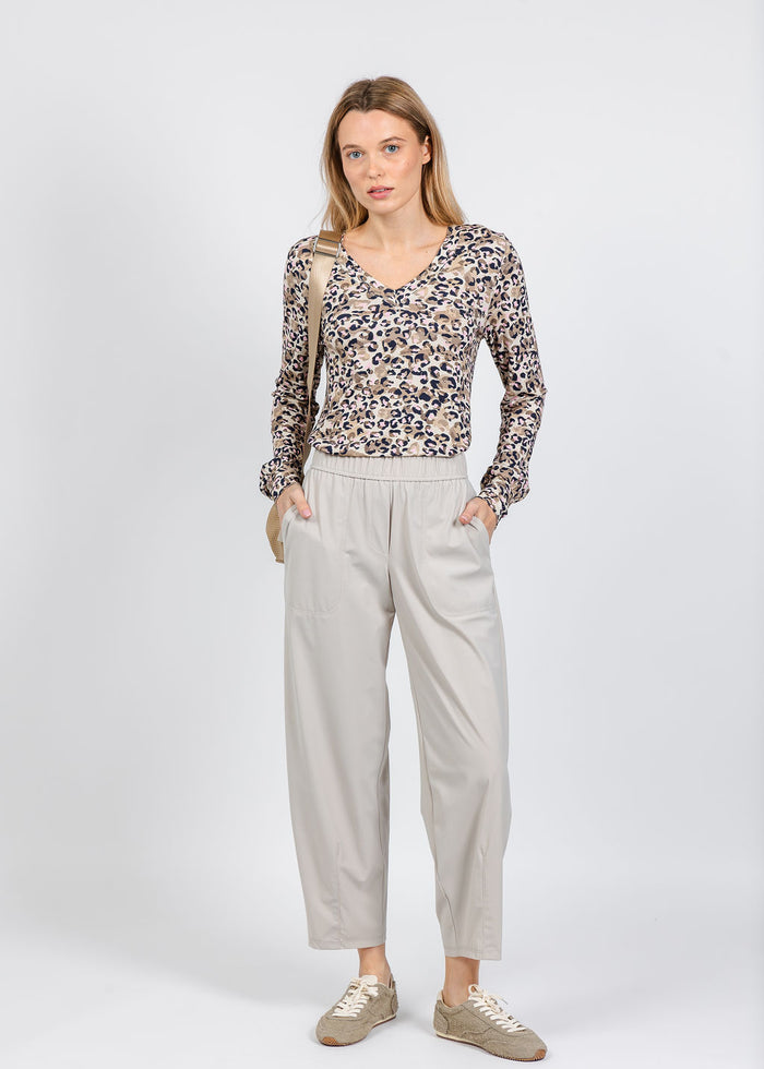 Elliott Lauren Leopard V-Neck Sweater in Pink paired with Elliott Lauren Prime Time Tapered Pant in Caulk available at Barbara Katz