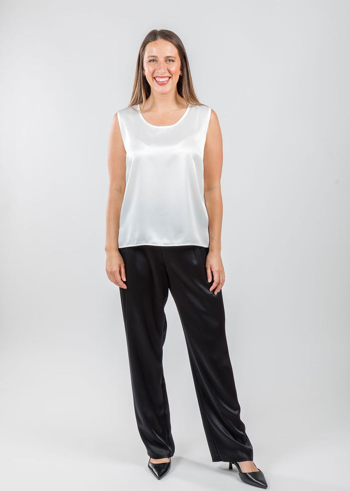 Caroline Rose Soft Satin Tank in White paired with Caroline Rose Soft Satin Pants in Black available at Barbara Katz
