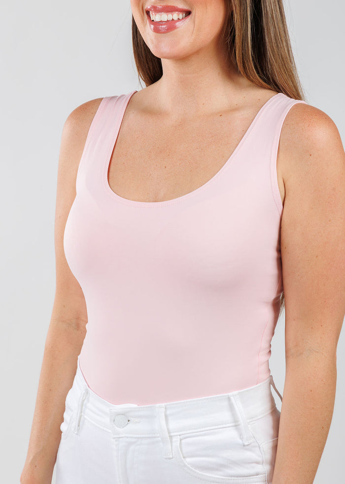 A'NUE The Classic Micro Tank Top in Ballet Slipper featuring a scoop neckline, wide shoulder straps, form-fitting fit, travel-friendly style available at Barbara Katz.