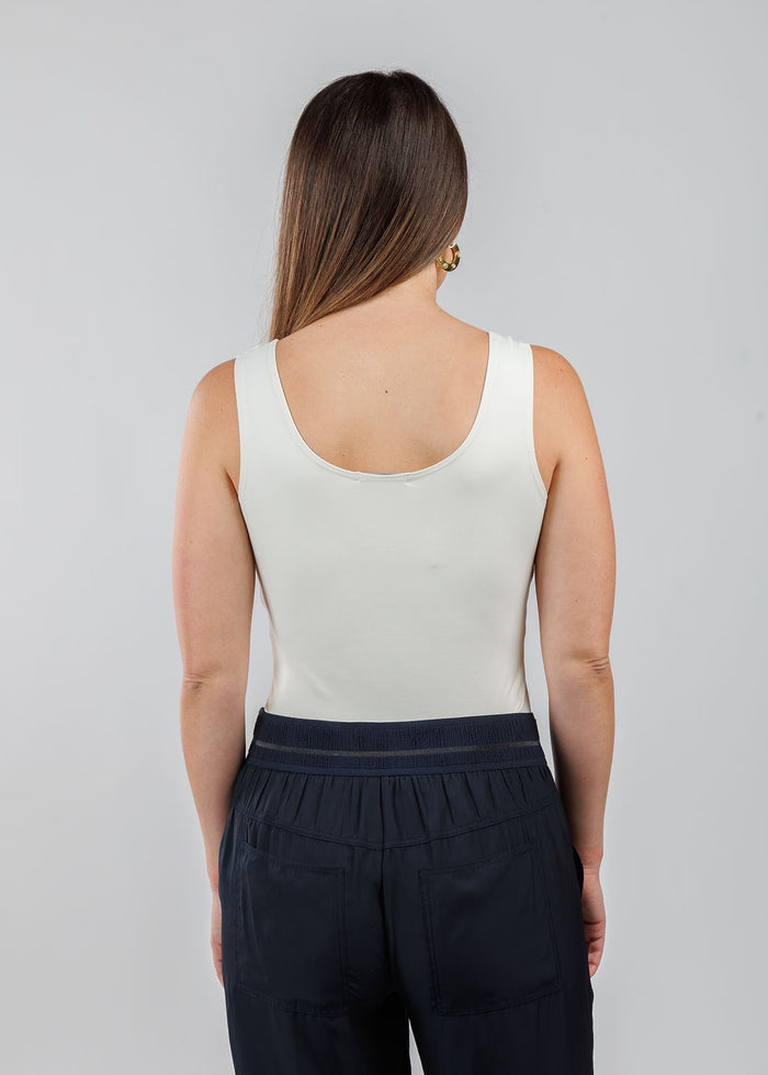 A'NUE The Classic Micro Tank Top in Cream featuring a scoop neckline, wide shoulder straps, form-fitting fit, travel-friendly style available at Barbara Katz.