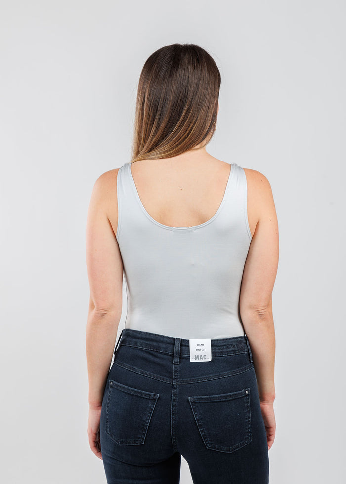 A'NUE The Classic Micro Tank Top in Platinum featuring a scoop neckline, wide shoulder straps, form-fitting fit, travel-friendly style available at Barbara Katz.