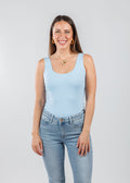 A'NUE The Classic Micro Tank Top in Powder featuring a scoop neckline, wide shoulder straps, form-fitting fit, travel-friendly style available at Barbara Katz.